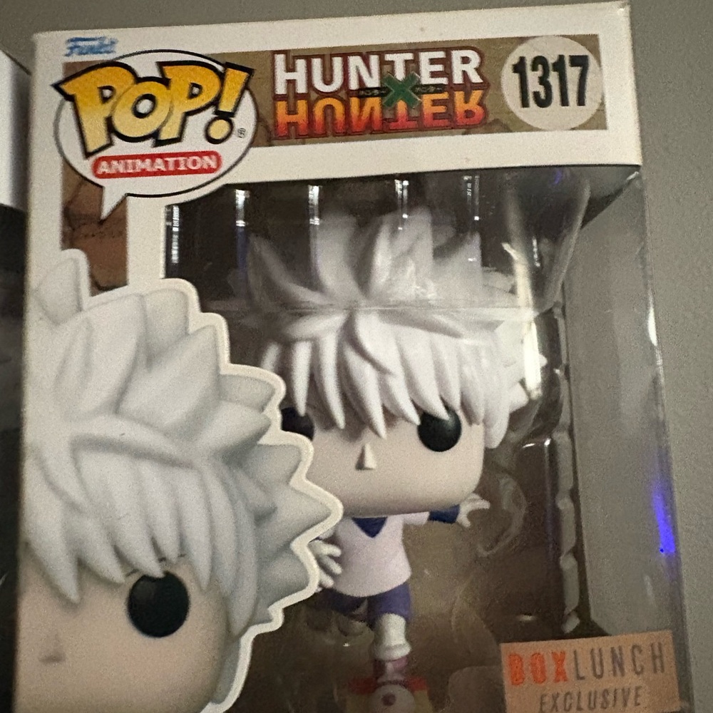 Funko Pop Animation Figure with White Hair and Blue Outfit